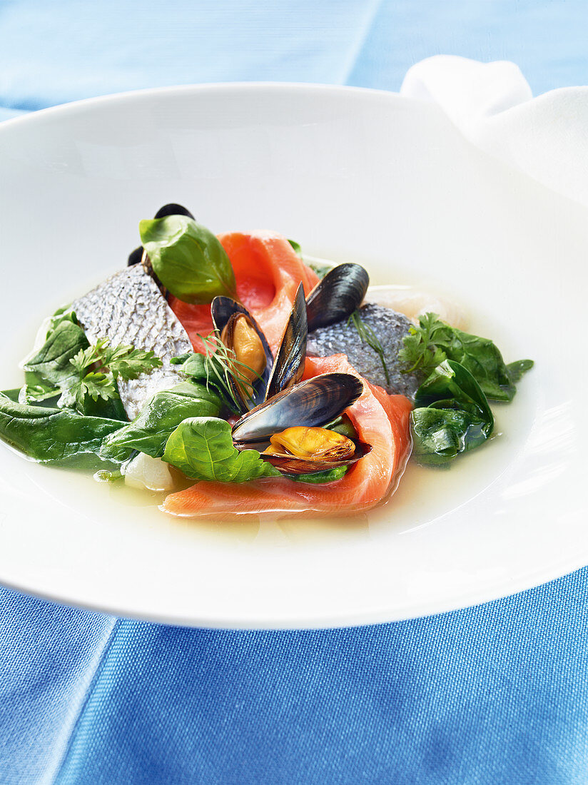 Fish soup with clear tomato stock