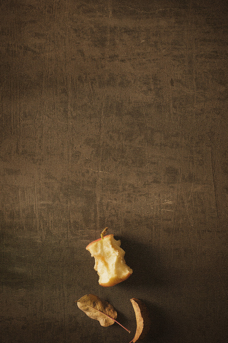 An apple core and leaves