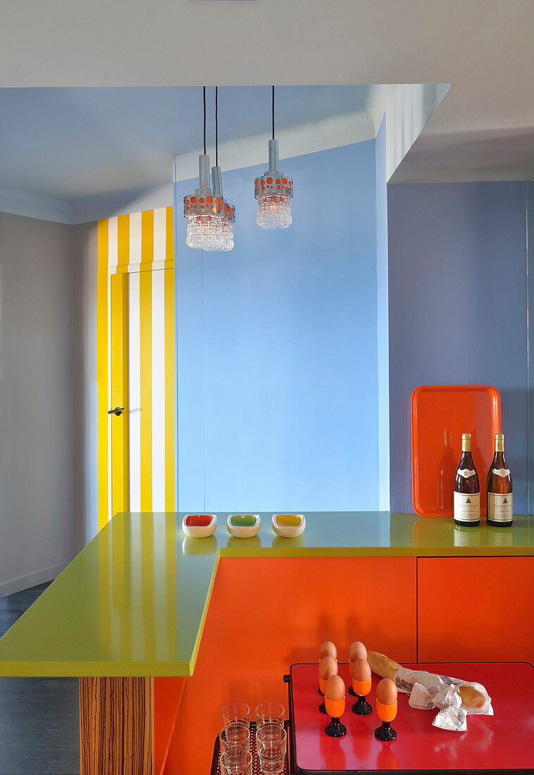 Colourful breakfast bar in kitchen with blue walls