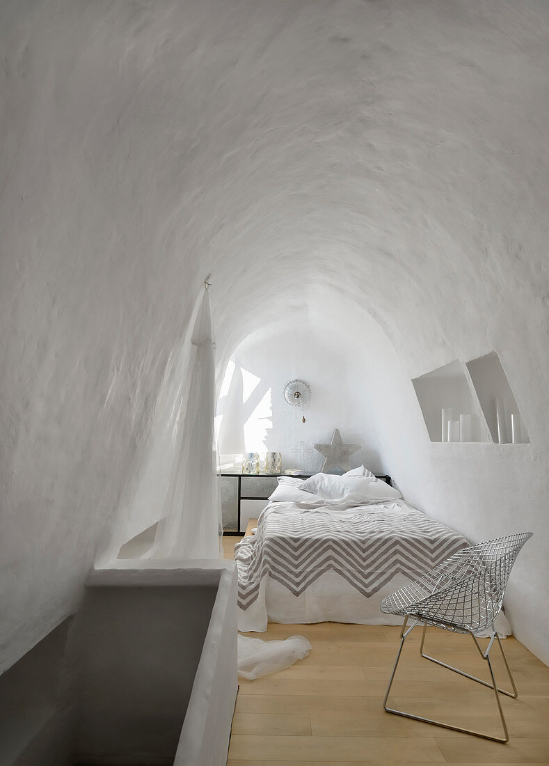 White bedroom with vaulted ceiling