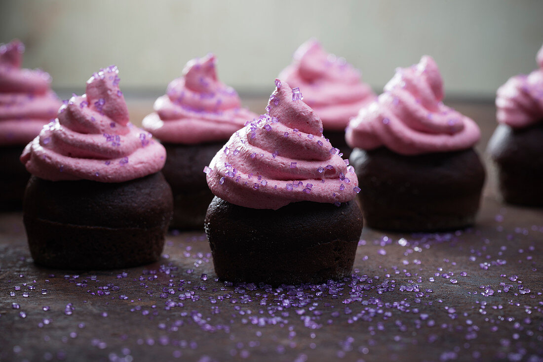 Vegan chocolate cupcakes with raspberry and marzipan cream