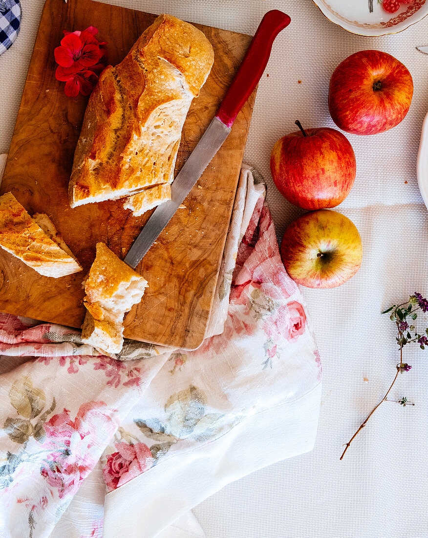A baguette and fresh apples