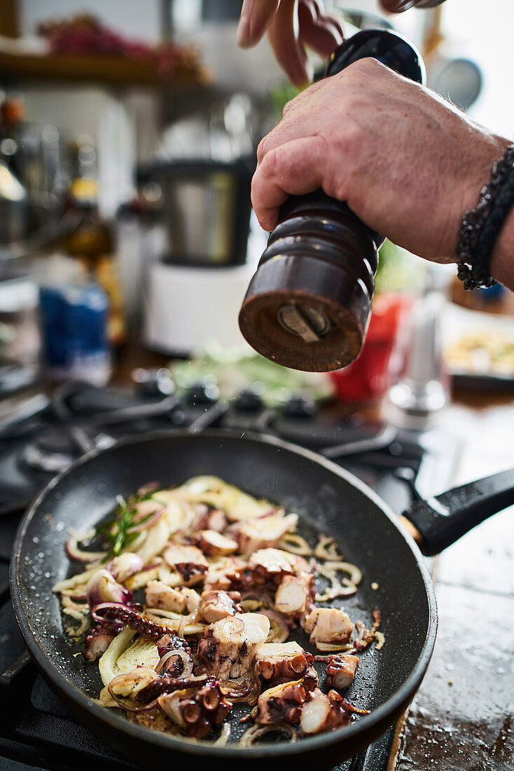 Pepper ground over a pan