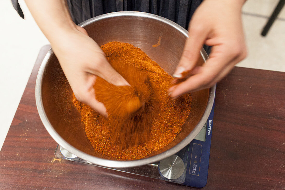 Hand blending organic paprika