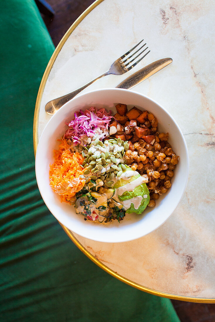 Vegan bowl with quinoa, buckwheat and tahini dressing