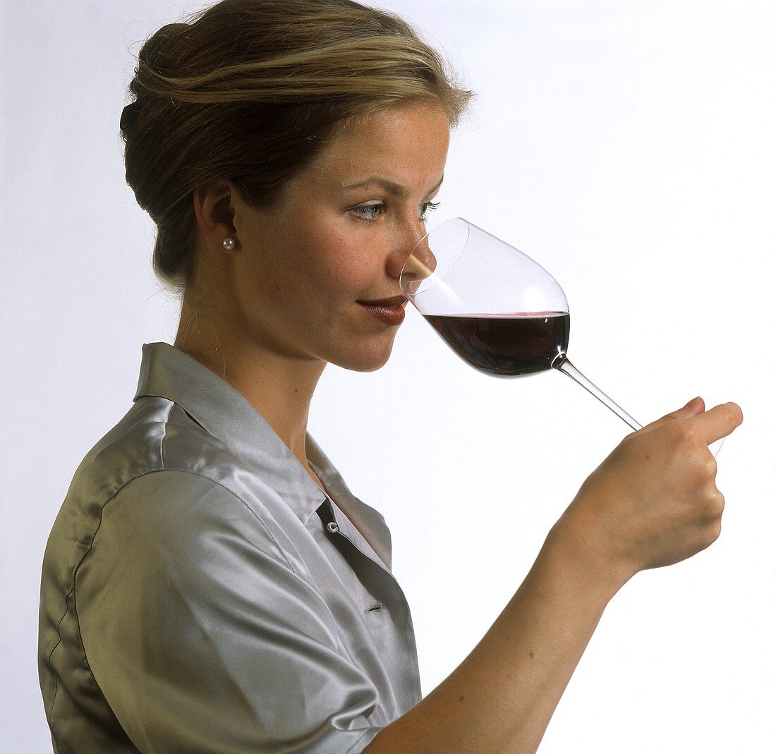 A Woman Sniffing a Glass of Wine