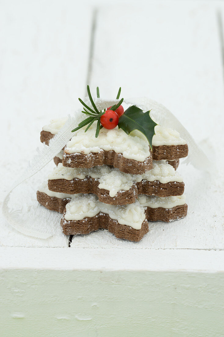 Snowflake biscuits with holly berries