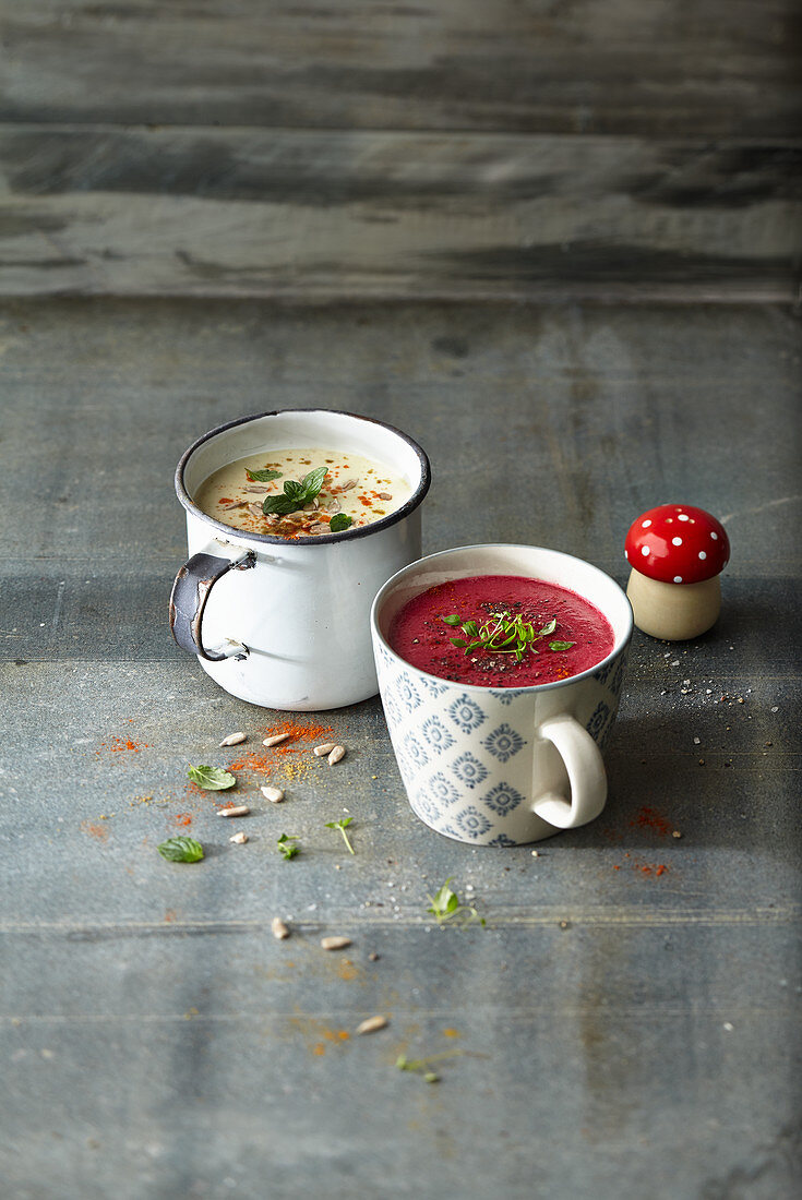 Cups of soup: coconut milk soup with dates, and beetroot soup with black salsify