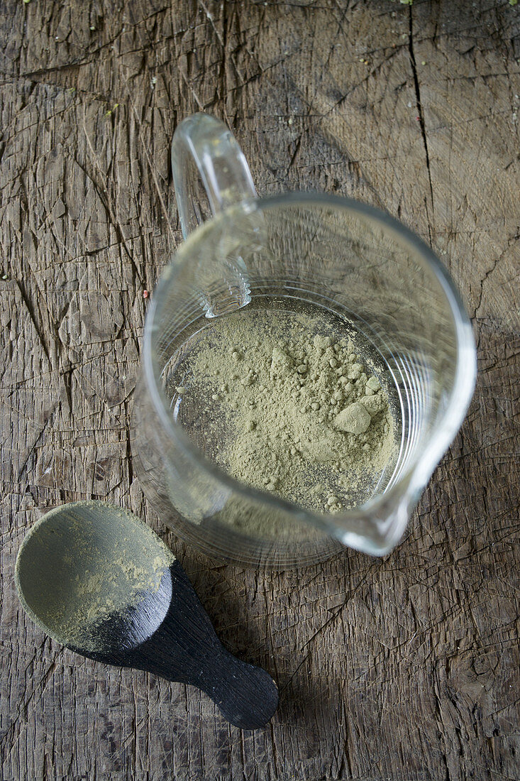 Matcha tea powder in a glass jug