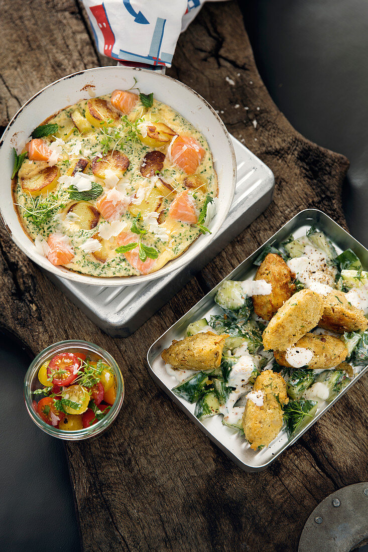 Salmon frittata with tomato salad and falafel with a yoghurt dip