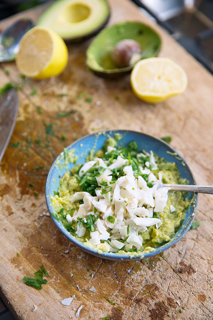 Avocado and egg salad being made