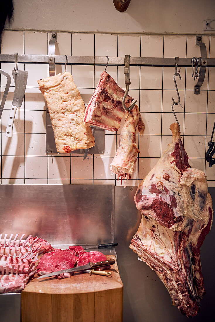 Hanging meats at a butcher