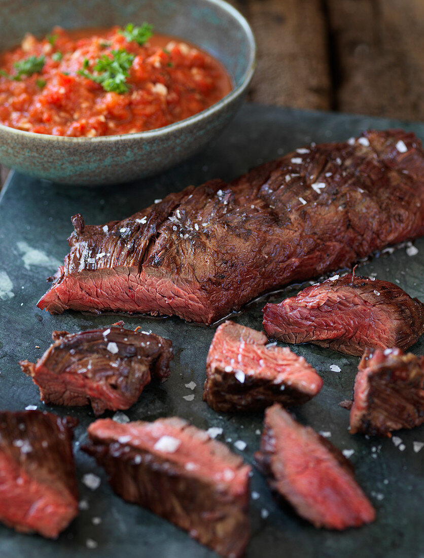 Hanger steak with a tomato and pepper sauce