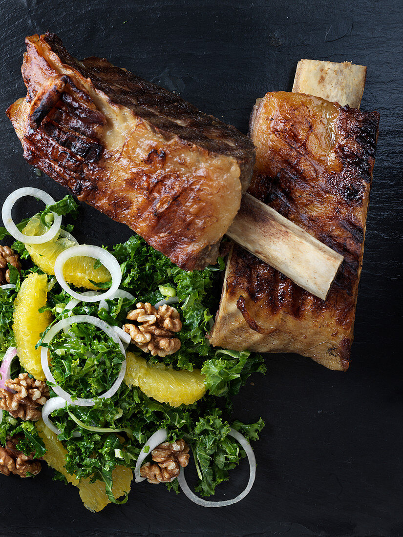 Beef ribs with a kale and orange salad