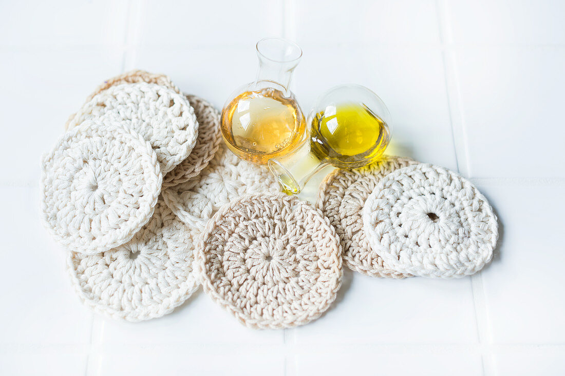 Facial cleansing pads hand-crocheted from white cotton yarn