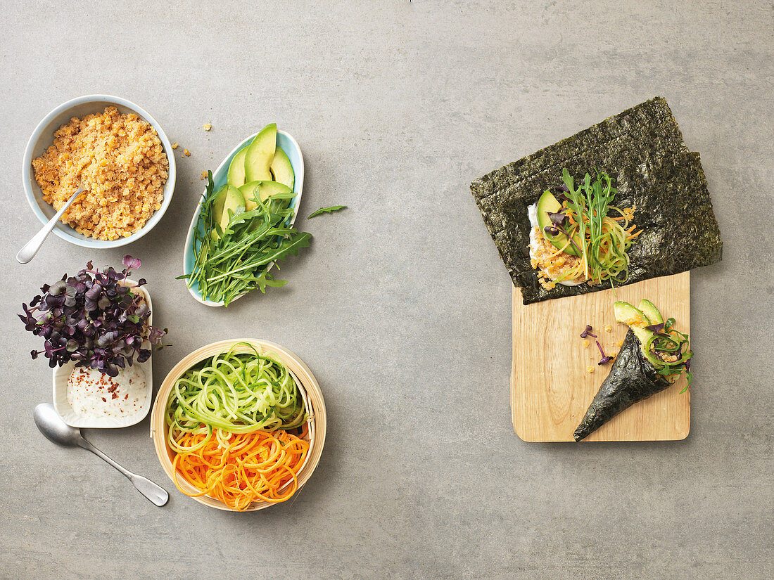 Temaki with carrots and cucumber being made