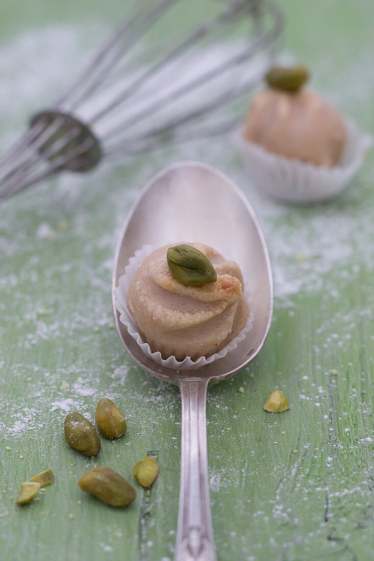 A chestnut praline with a pistachio