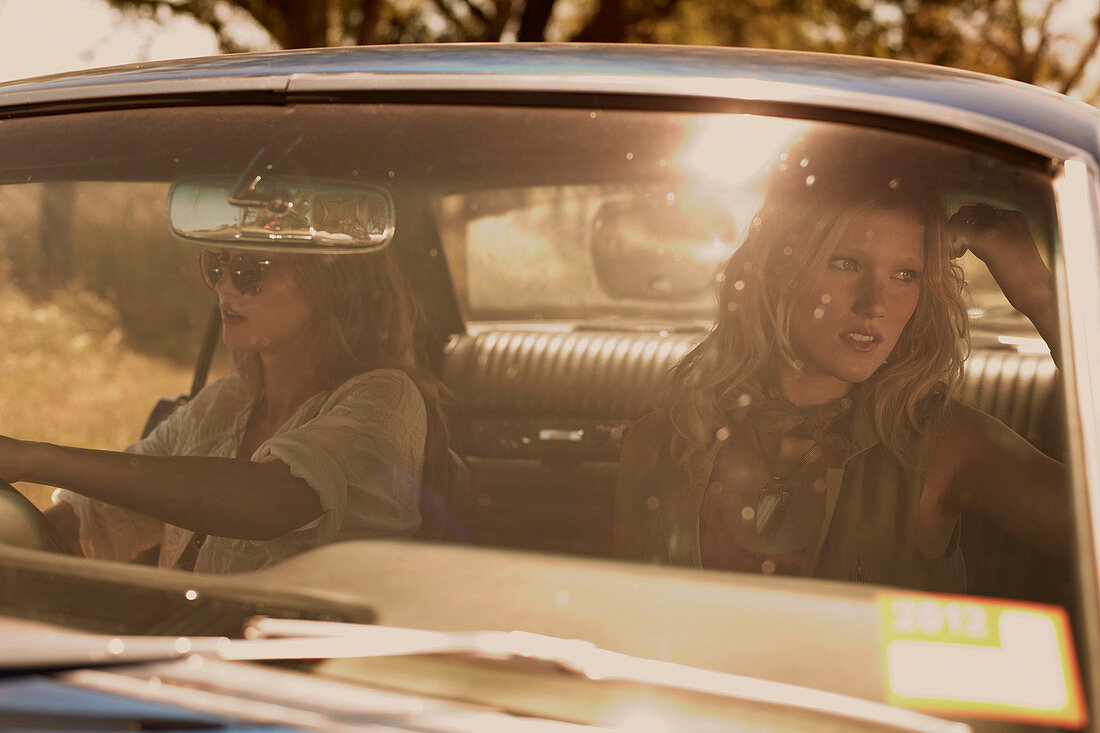 Two women sitting in a car