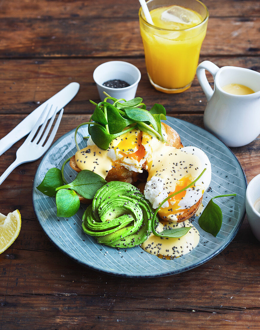 Toast with poached egg, sauce Hollandaise and avocado