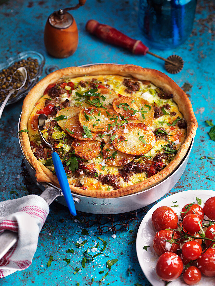 Potato and mince pie with baked tomatoes