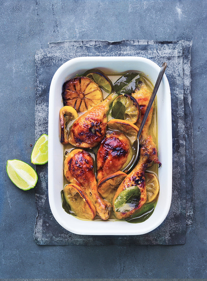 Chicken with lemon and lime in a sweet-and-sour garlic and curry marinade