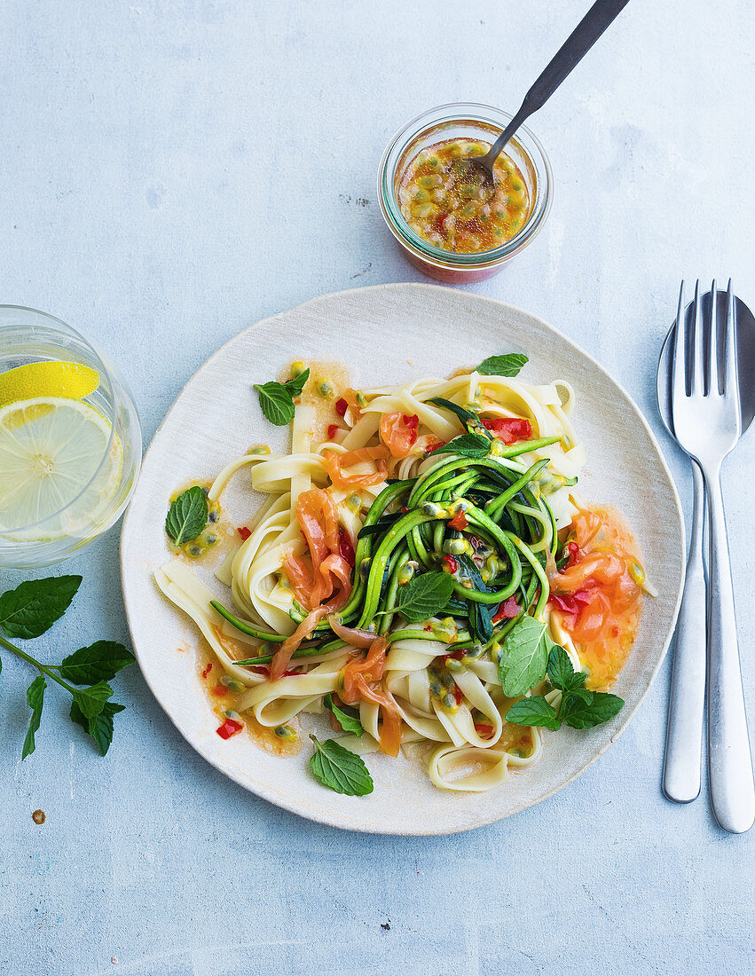 Tagliatelle with courgette noodles and salmon strips in a sweet-and-sour sauce
