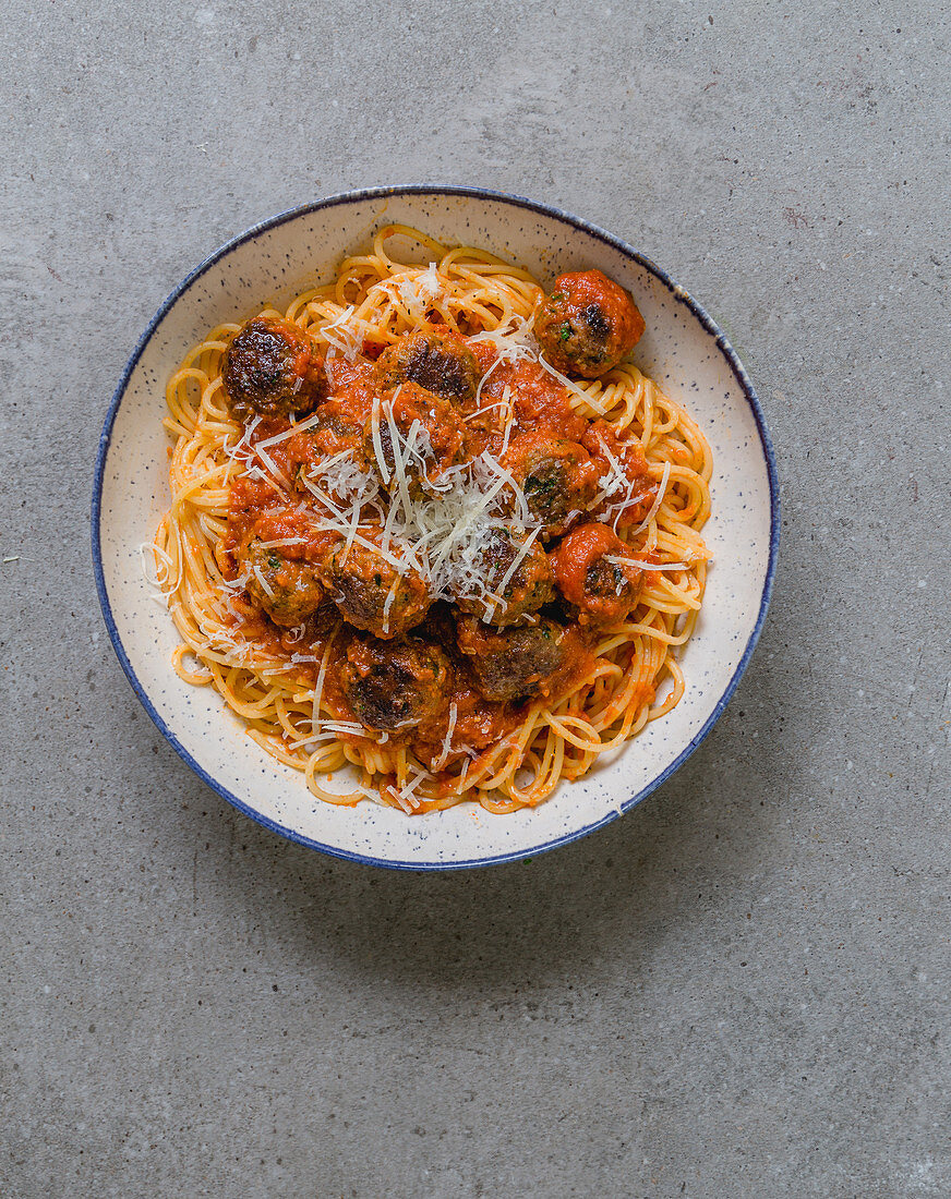 Spicy meatballs with tomato sauce on a bed of spaghetti