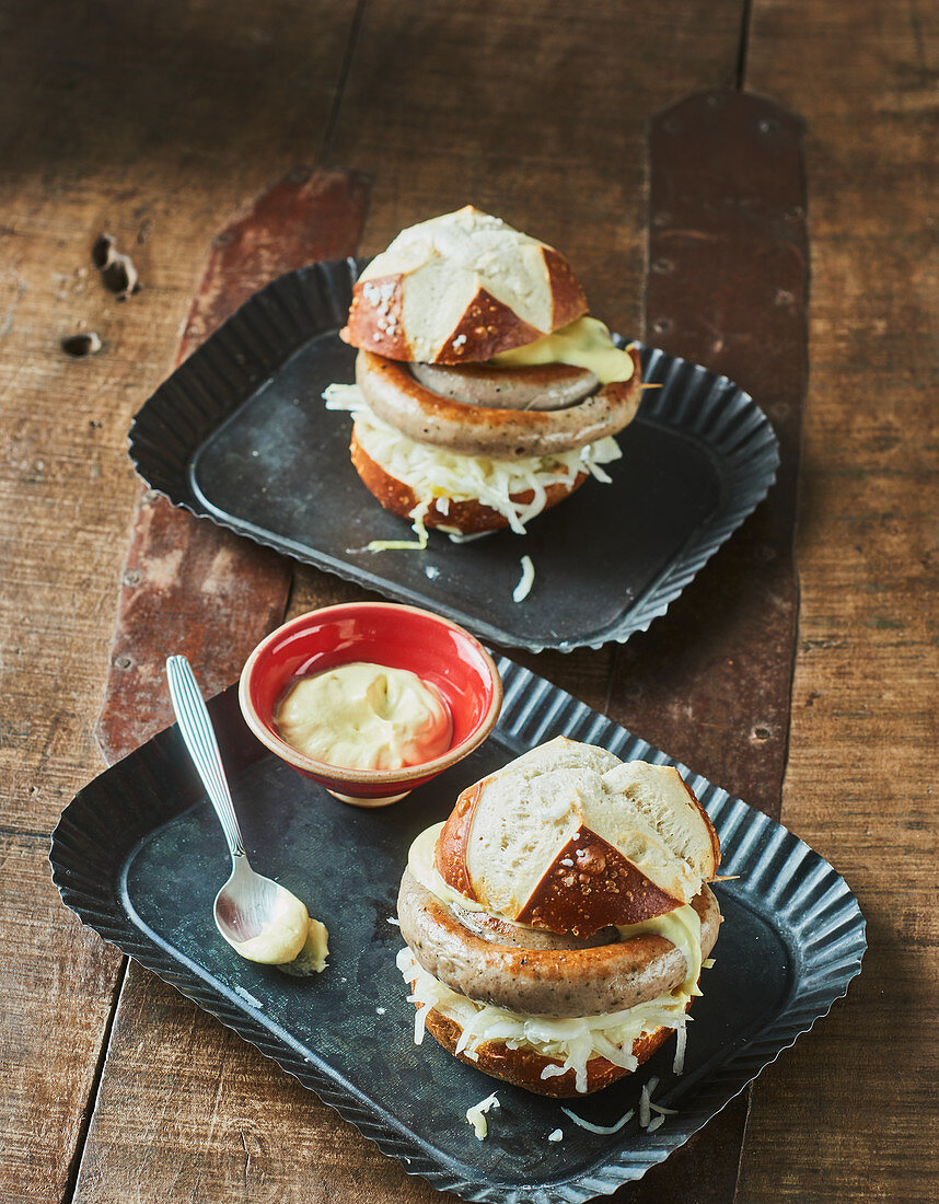 Sausage burger with coleslaw on a lye bread bun