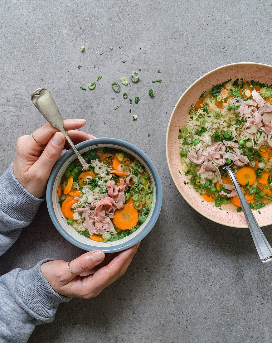 Noodle soup with vegetables and ham