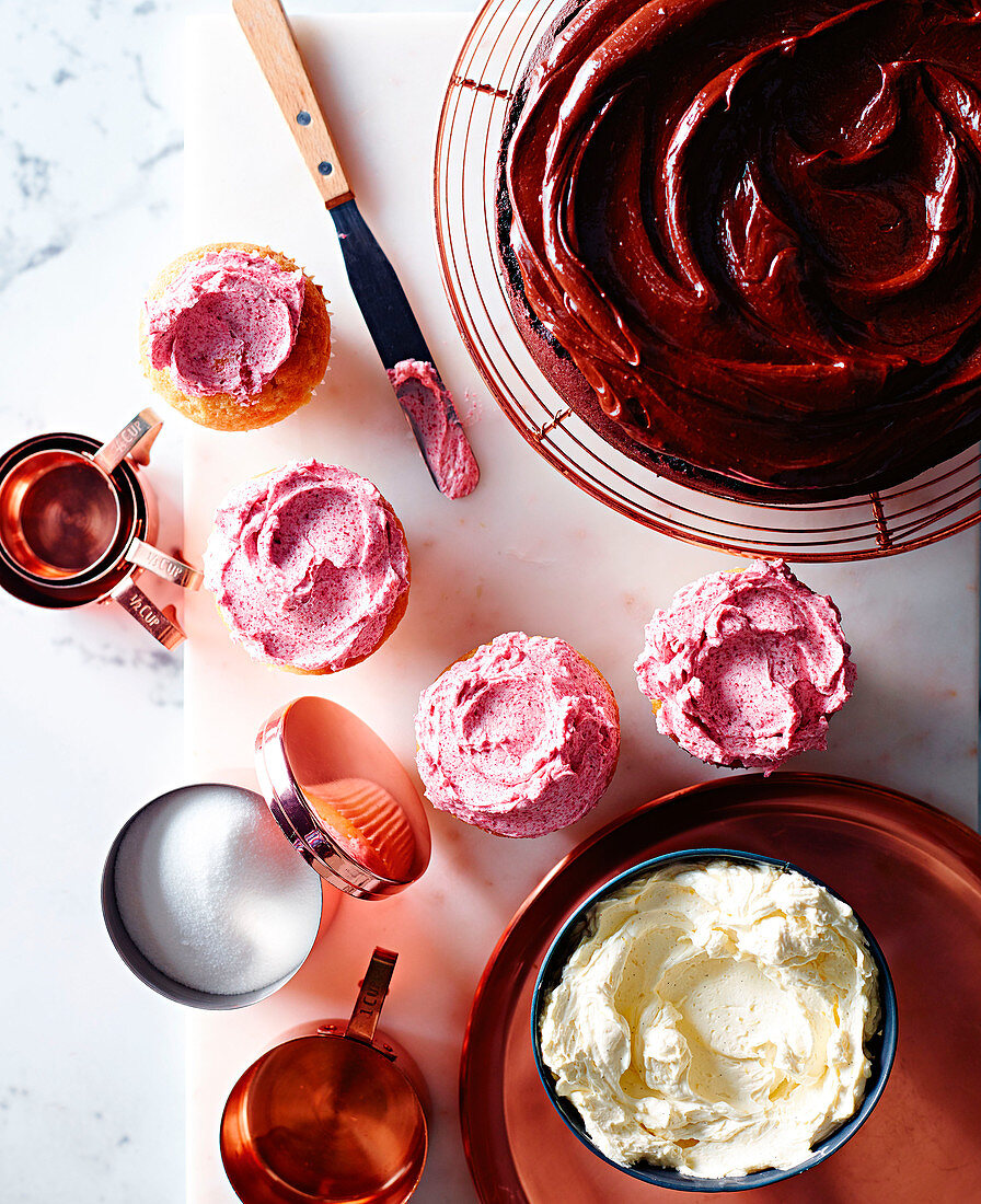 Dark chocolate ganache, raspberry swiss Meringue and vanilla lemon frosting