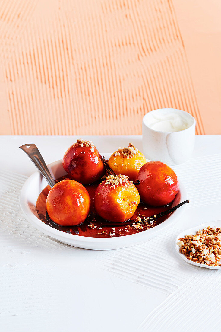 Poached peaches with ginger and hazelnut crumb