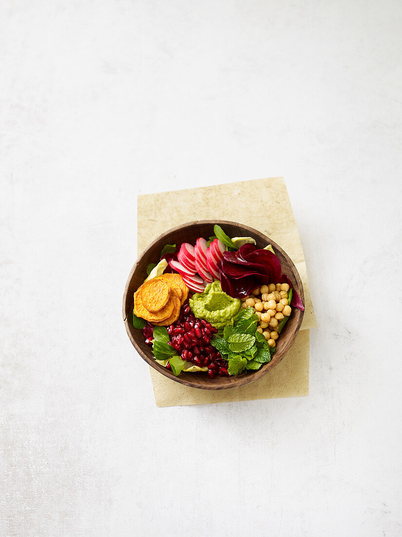 Buddha bowl with sweet potato and pomegranate seeds