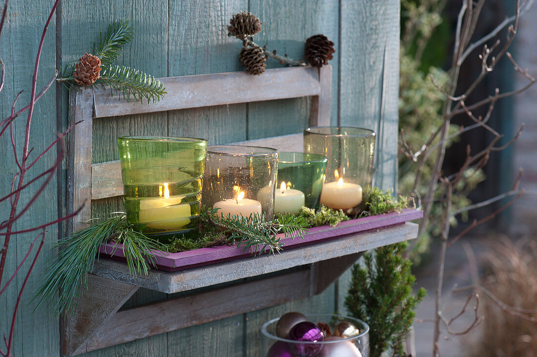 Wall frame with lanterns as an advent decoration