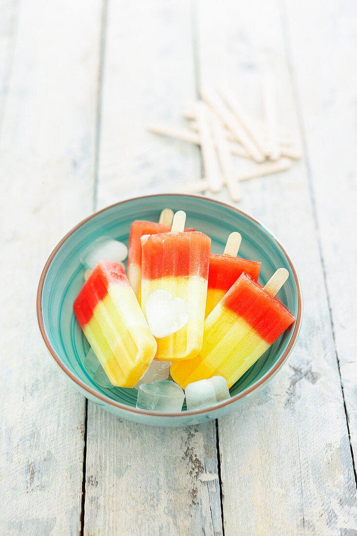 Tri-colored melon ice creams on sticks (vegan)