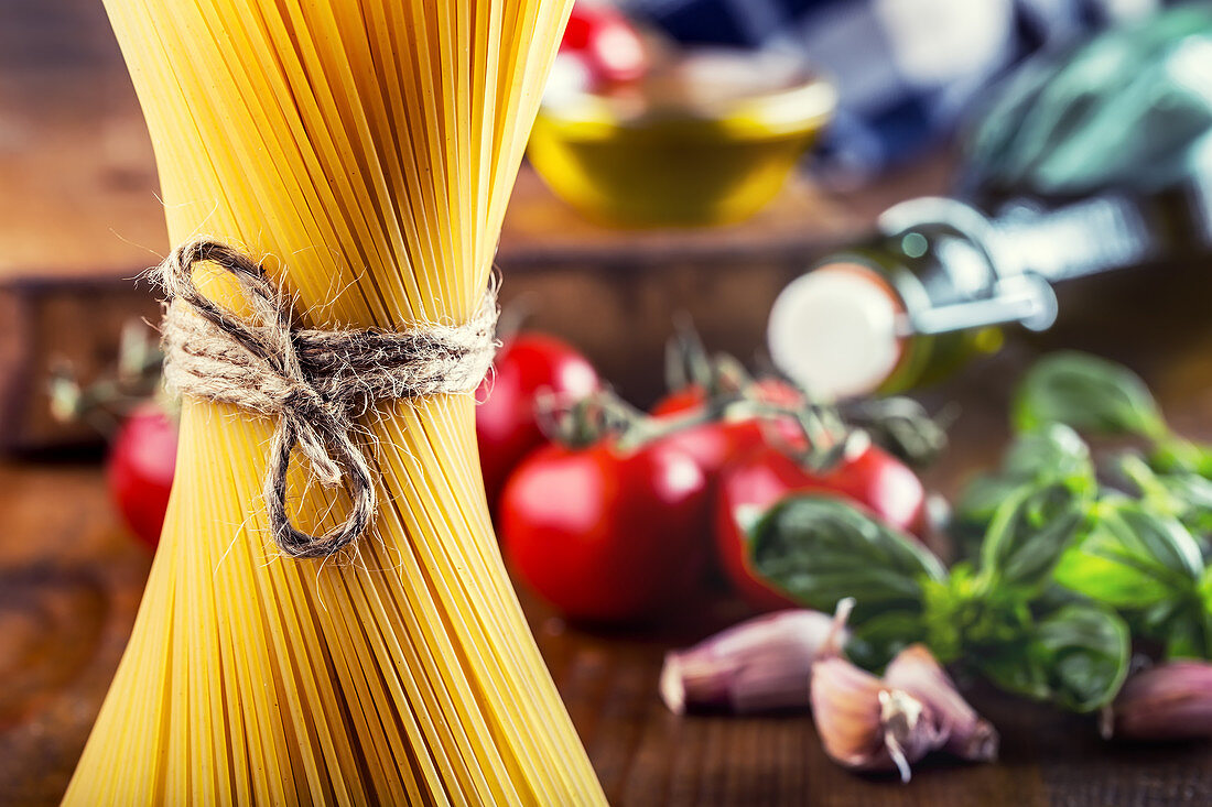 Spaghetti and some ingredients of Italian cuisine