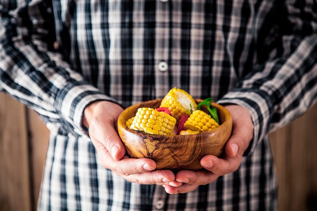 Man with corn (Mexican food)