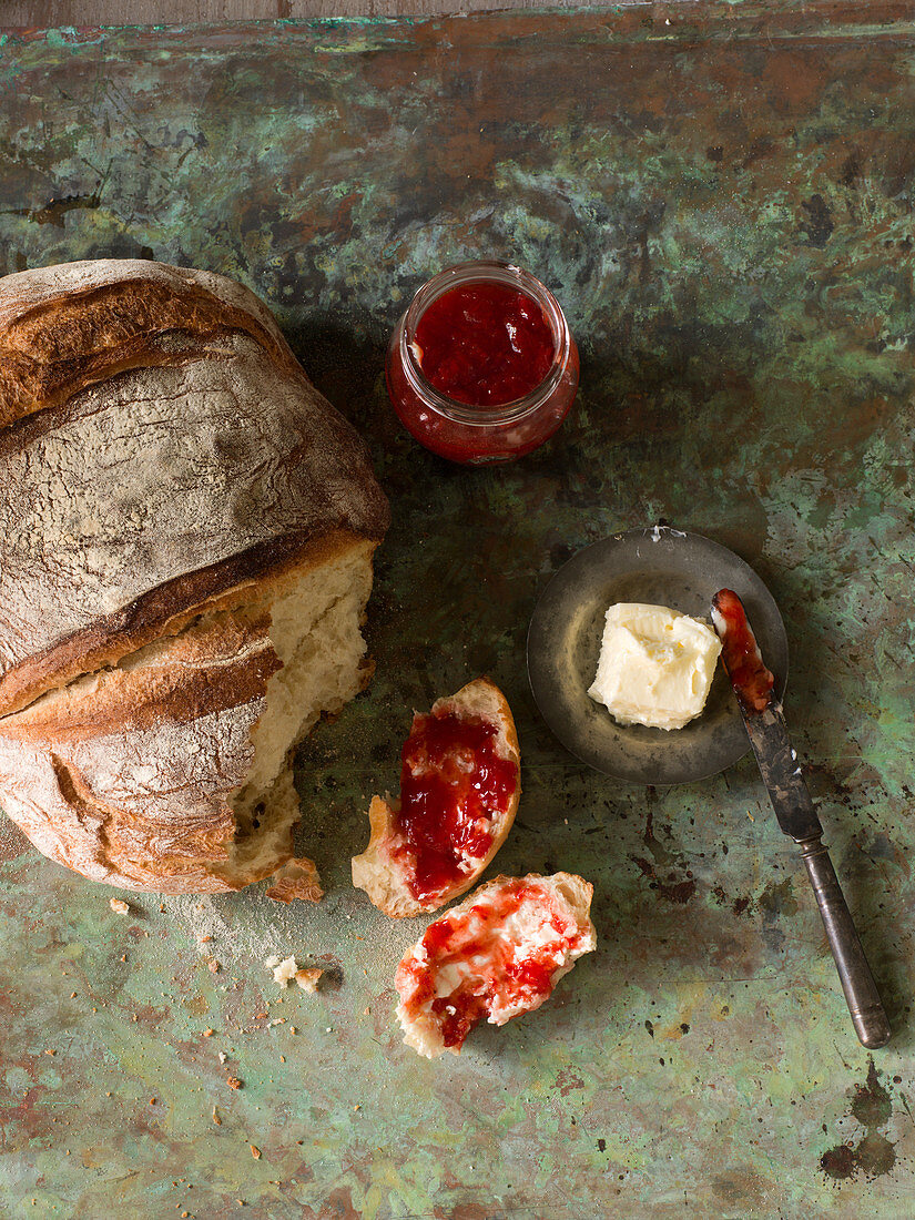 Bread with strawberry jam and butter