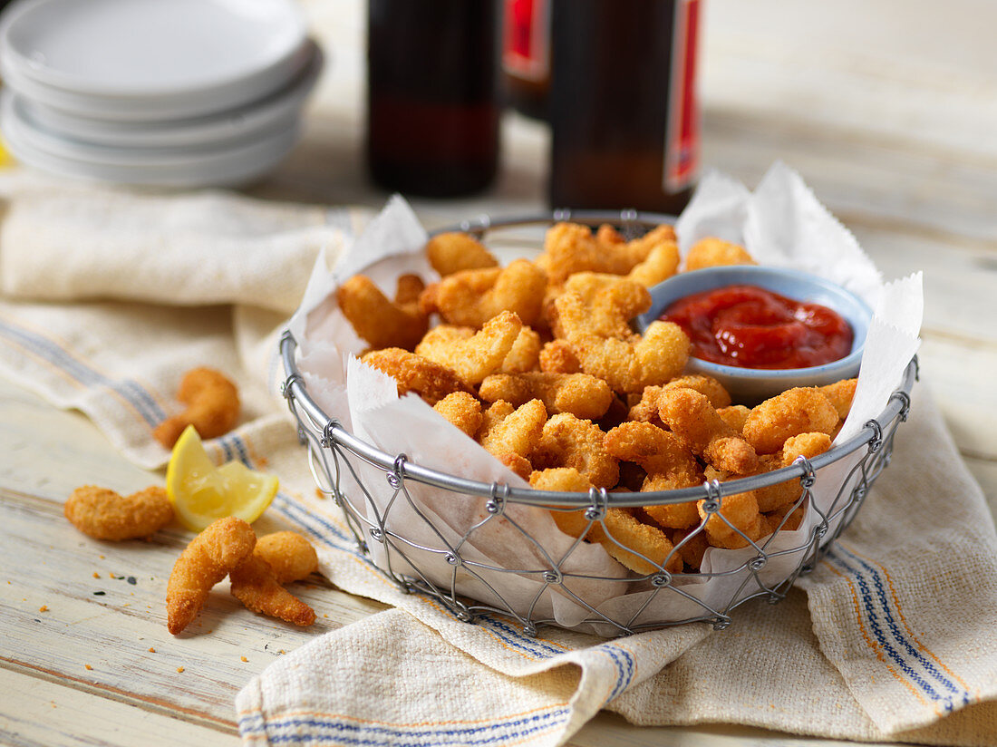 Fried breaded shrimp with ketchup