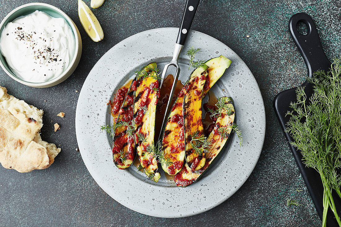 Grilled zucchini with harissa, yoghurt and flatbread