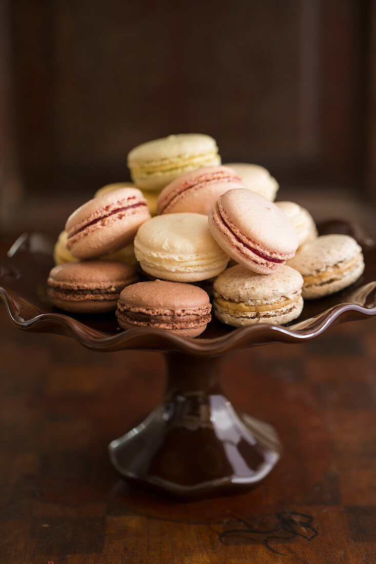 Various french macarons on a cake stand