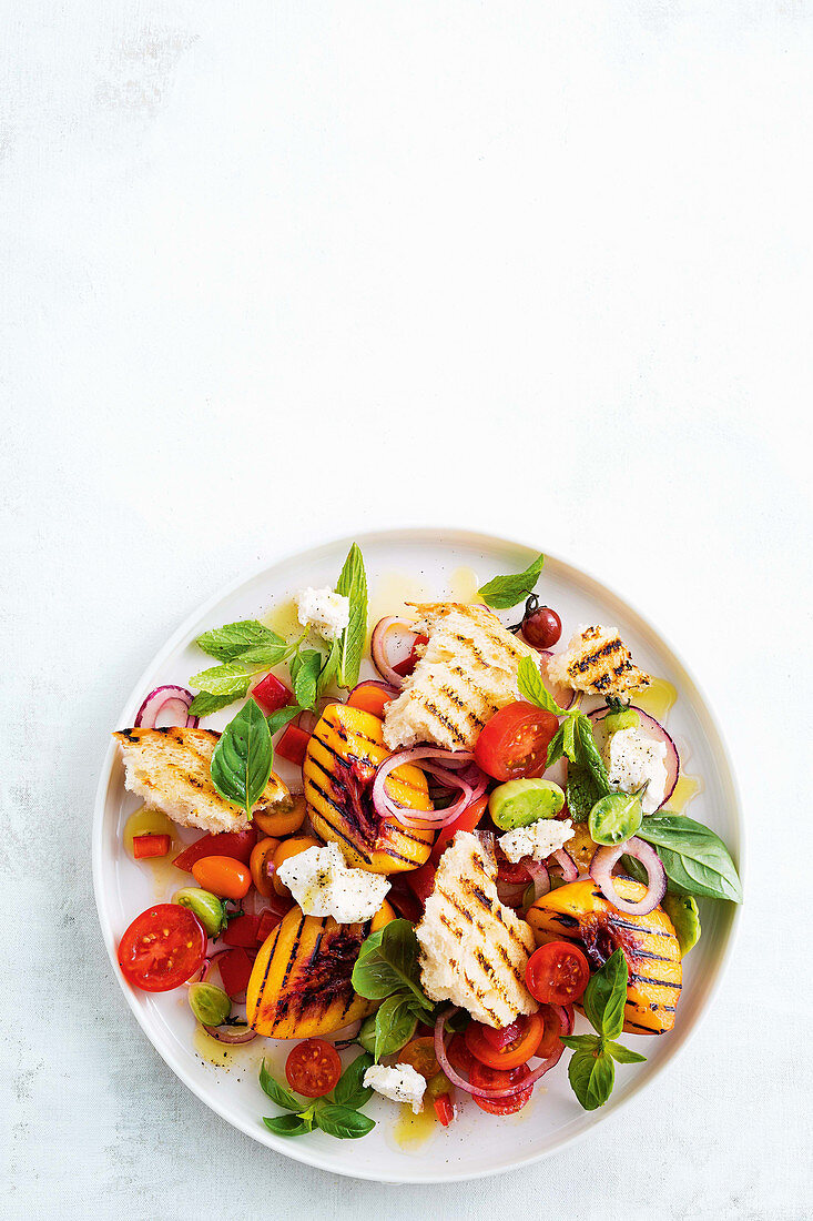 Panzanella with grilled peaches, tomatoes and goat's cheese