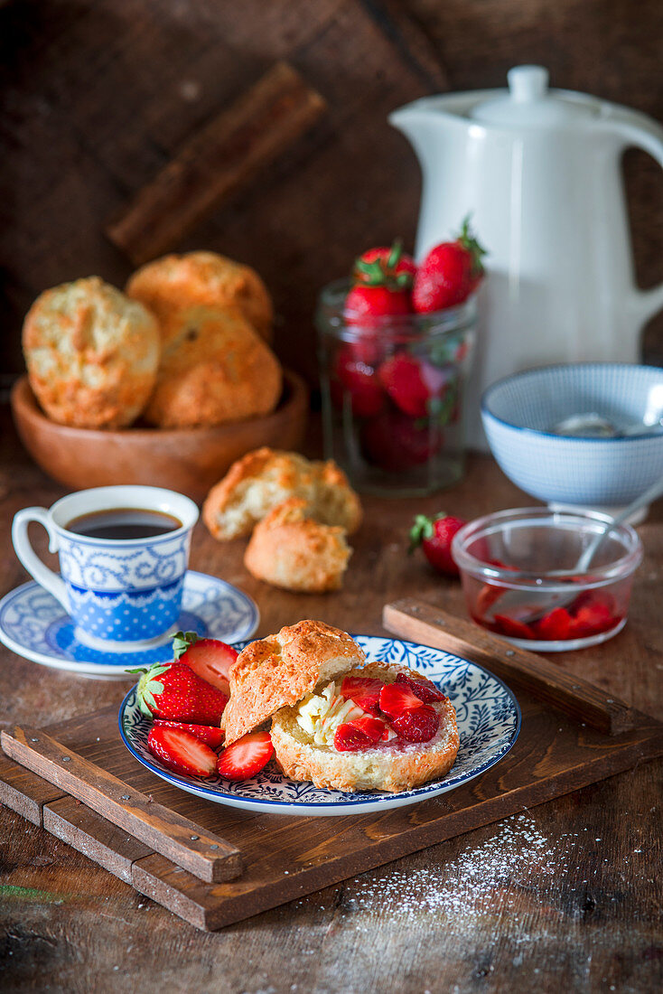 Scones with butter and strawberries