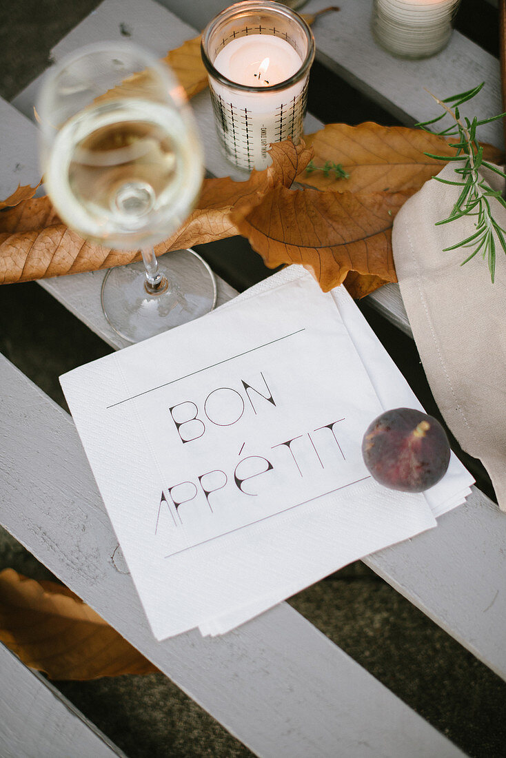 White wine glass and autumn table decorations