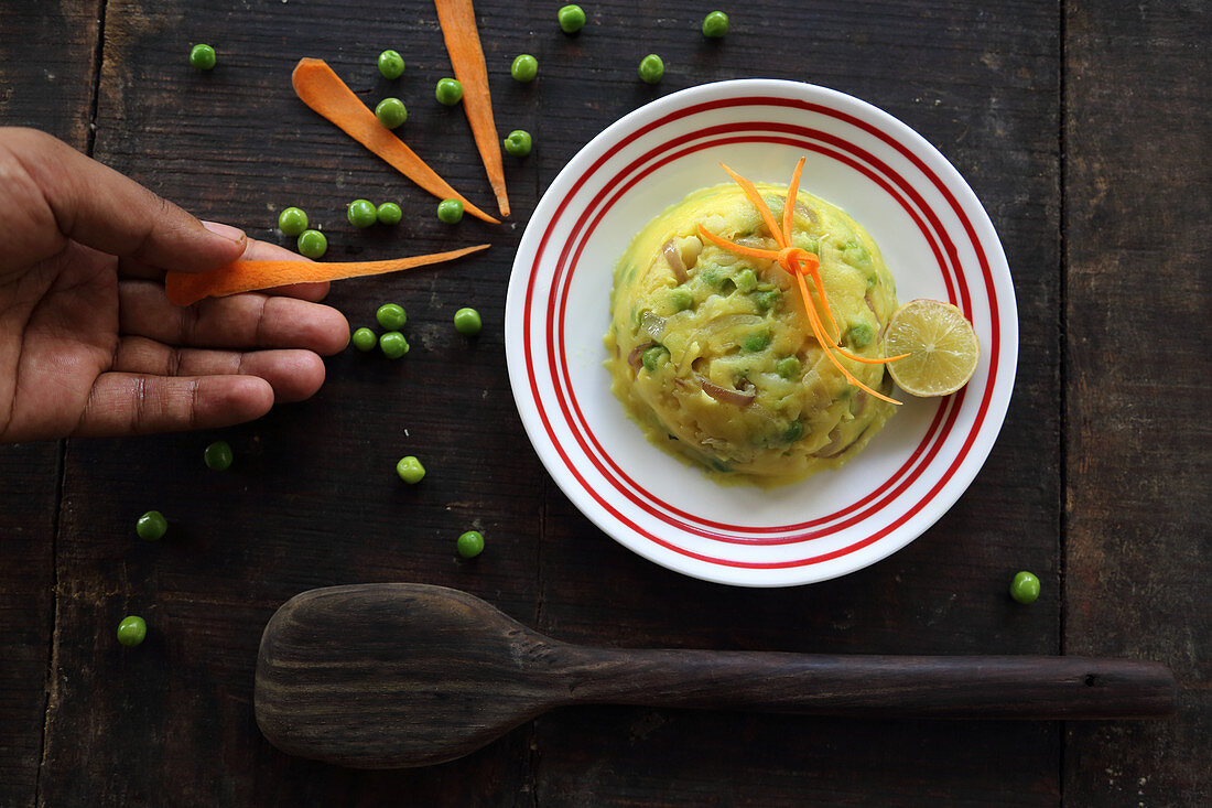 Mashed potatoes with peas and carrots