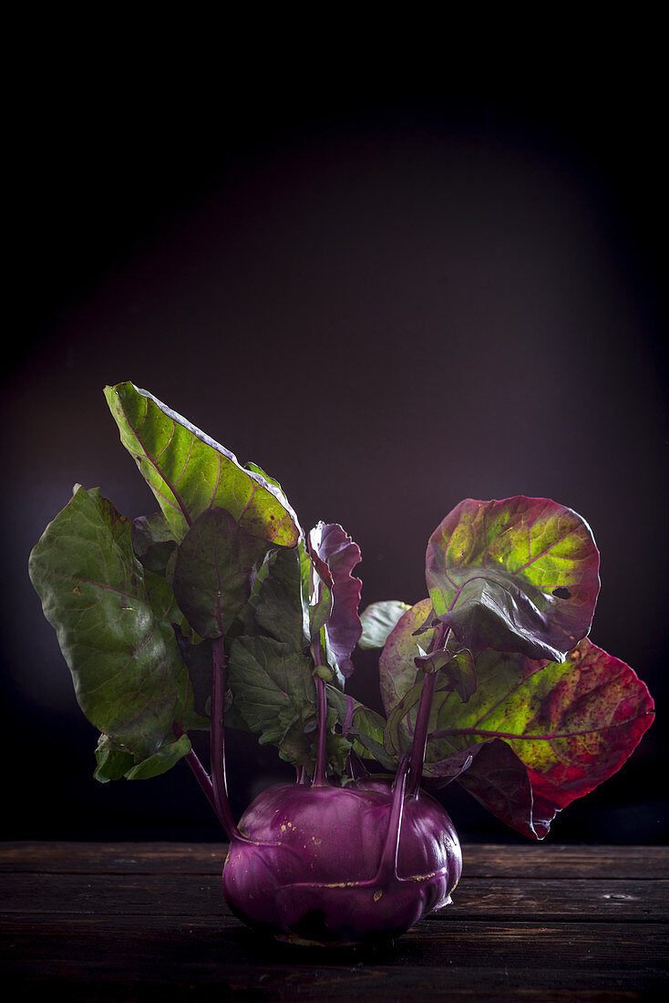 A kohlrabi on a wooden background