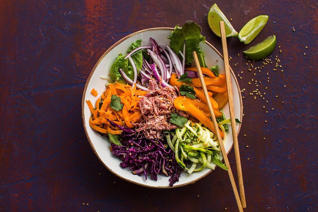 Buddha Bowl with carrots, zucchini, red cabbage and pork