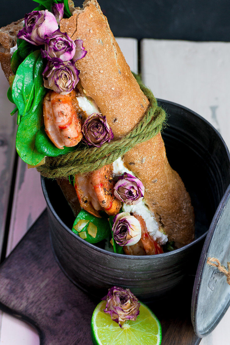 Baguette sandwich with prawns and dried rose buds