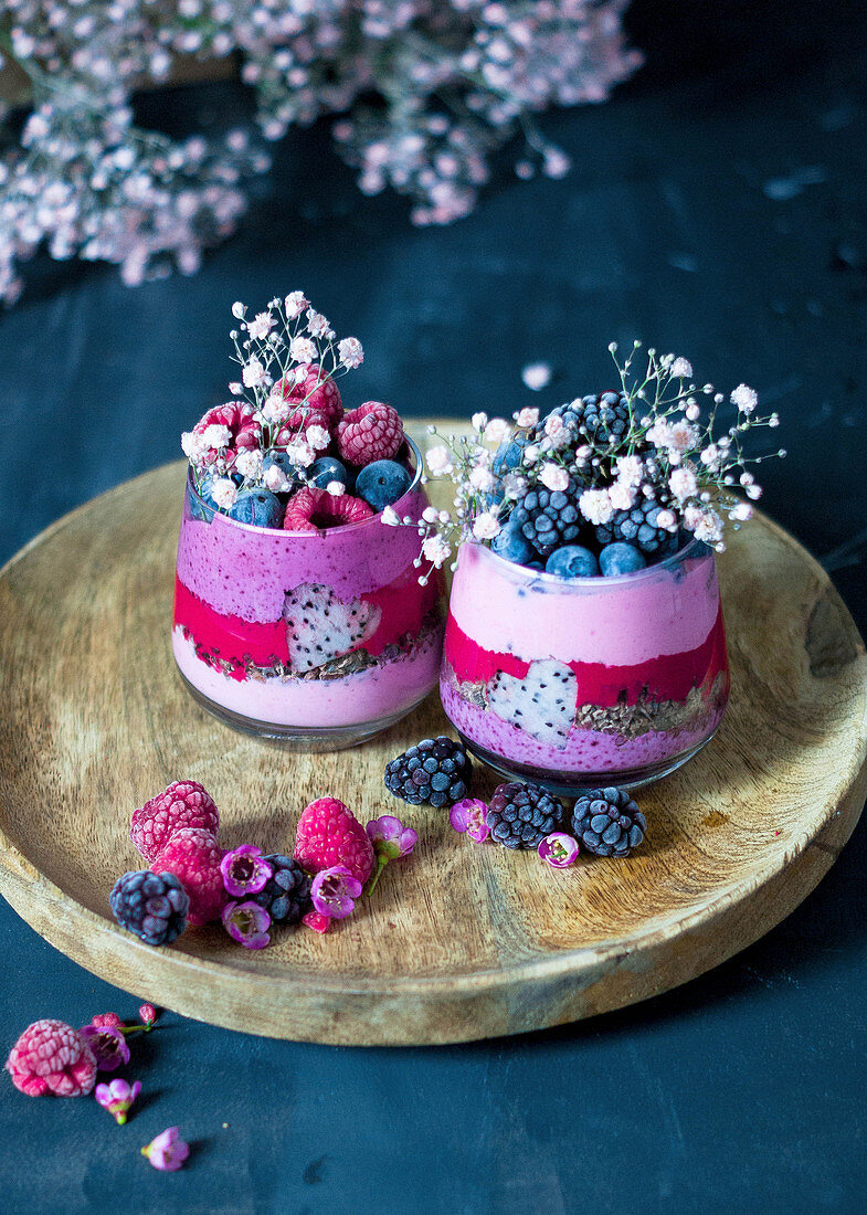 Smoothies (strawberries, raspberries, blueberries) with dragon fruit and chocolate muesli