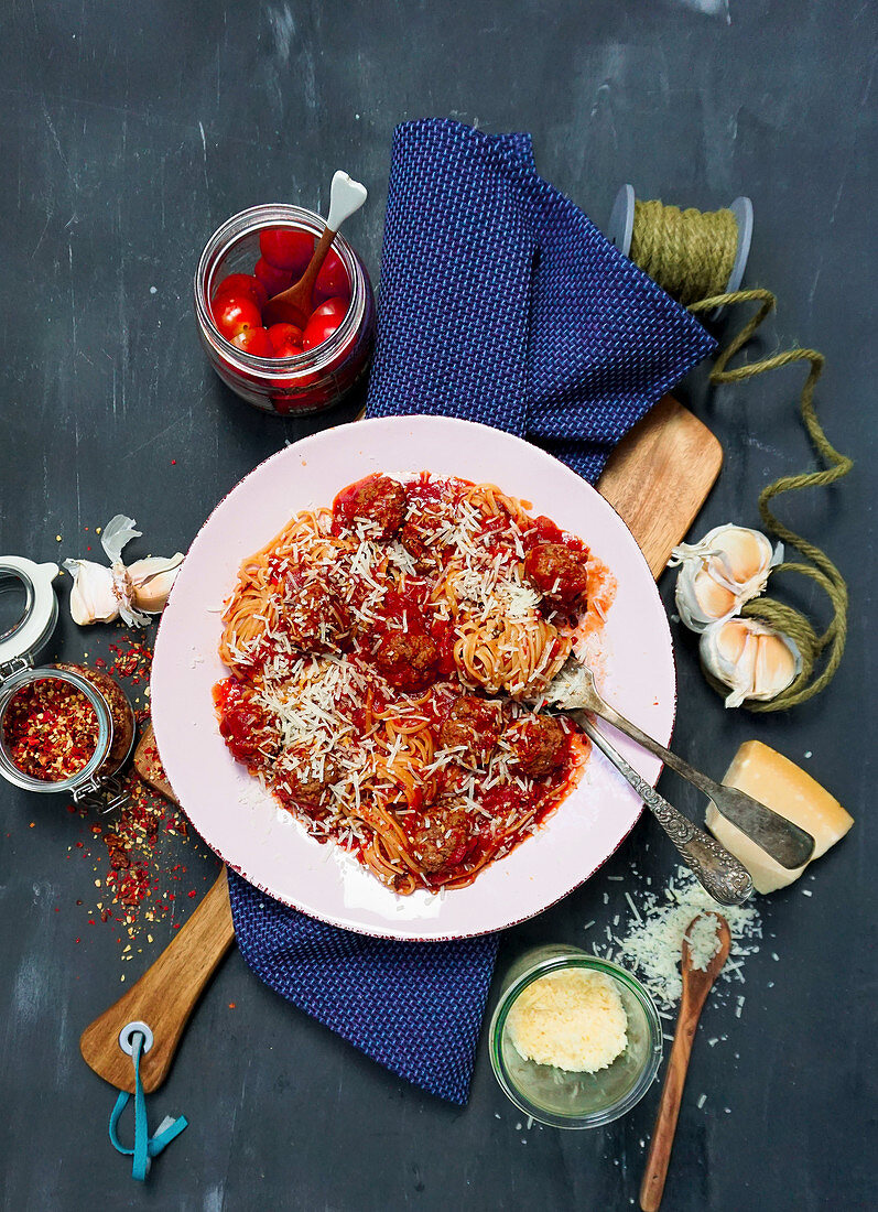 Spaghetti with meatballs, tomato sauce and Parmesan cheese