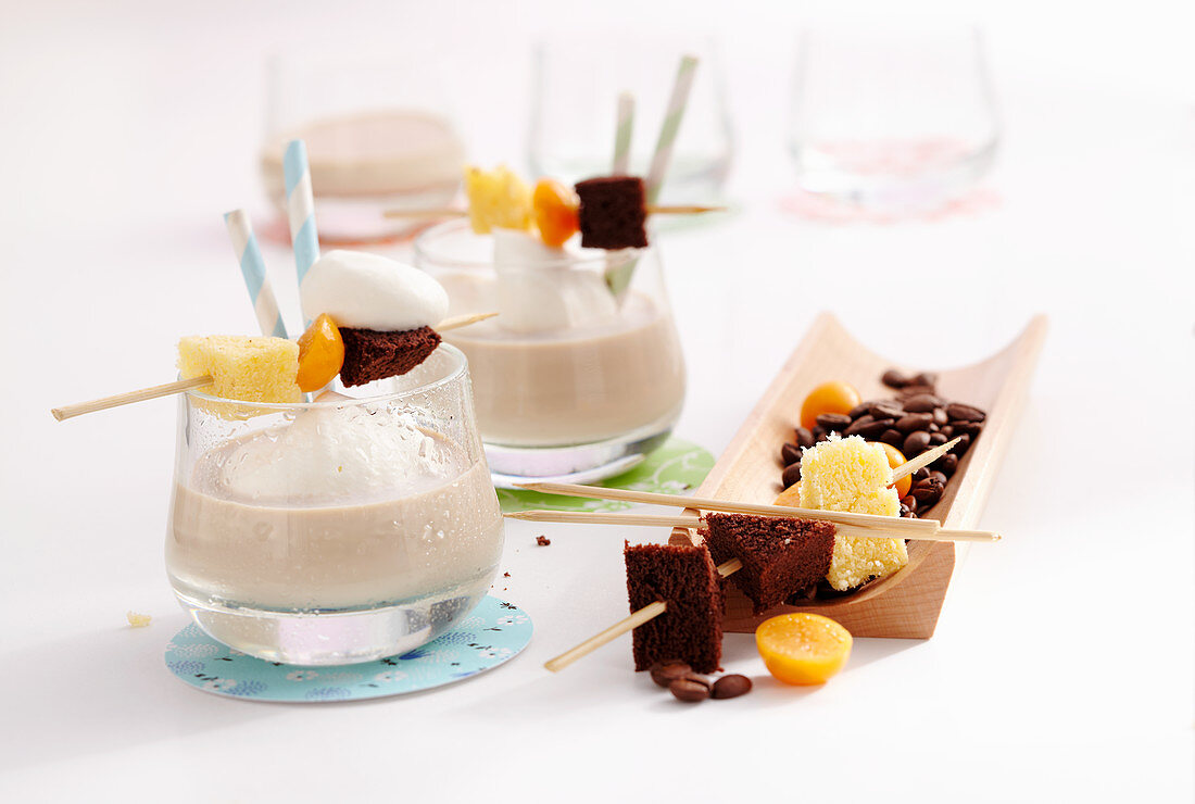 Coffee-milk drinks with coffee liqueur, milk and cream served with chocolate cake